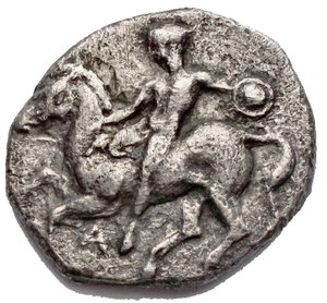 obverse: Greek coins Calabria. Tarentum. Nomos. ca. 344-340 BC d / Naked warrior on horseback on the left, with a small round shield; A below. r / Taras astride a dolphin facing left. 6.99 g. 21.3 x 19.7 mm. aVF