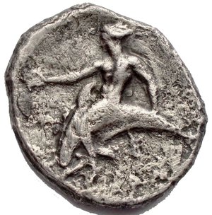 reverse: Greek coins Calabria. Tarentum. Nomos. ca. 344-340 BC d / Naked warrior on horseback on the left, with a small round shield; A below. r / Taras astride a dolphin facing left. 6.99 g. 21.3 x 19.7 mm. aVF
