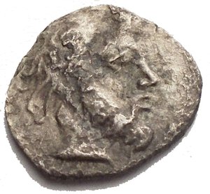 obverse: SICILY. Abacaenum. AR Litra (0.36 gms), ca. 450-400 B.C.  Head of bearded male facing right; Reverse: Boar standing left, acorn at left, above legend. VF