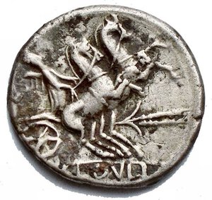 reverse: Roman Republic - T. Cloelius (ca. 128 BC). AR denarius (20.1mm, 3.84 gm). VF. Rome. Head of Roma right, wearing winged helmet surmounted by griffin crest; wreath behind / T•CLOVLI, Victory driving rearing biga right; stalk of grain below. Crawford 260/1. Cloulia 1.