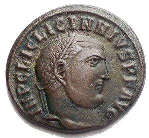 obverse: Licinius I Æ Nummus. Antioch, AD 312. IMP C LIC LICINNIVS P F AVG, laureate head right / GENIO AVGVSTI, Genius standing left, holding head of Sol and cornucopiae; *- I across fields, ANT in exergue. 5.18g, 21.5 x 19.7mm Good Very Fine.