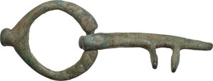 obverse: BRONZE KEY RING  Roman period, c. 1st-4th century AD.  Bronze key with two small dentils.  Dimensions: 52 x 19.5 mm