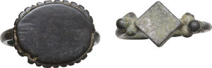 reverse: TWO ANCIENT RINGS  Medieval period, c. 7th - 15th century AD.  Lot of two rings, one in bronze and the other in a silver alloy.  Inner diameters: 18 mm and 19 mm