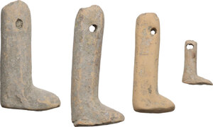 obverse: FOUR POTTERY DOLL LEGS  Greek world, c. 5th century BC.  Lot of four ancient doll legs, pertaining to three or four different dolls, all pierced to be mounted.  Sizes: 61x25 mm, 50x21 mm, 55x29 mm, 22x15 mm
