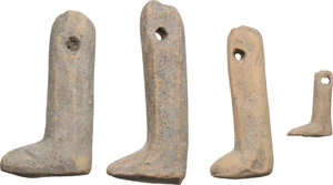 reverse: FOUR POTTERY DOLL LEGS  Greek world, c. 5th century BC.  Lot of four ancient doll legs, pertaining to three or four different dolls, all pierced to be mounted.  Sizes: 61x25 mm, 50x21 mm, 55x29 mm, 22x15 mm