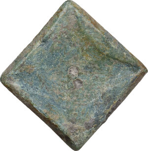 reverse: HELLENISTIC BRONZE WEIGHT  Greek Sicily (?), c. 4th-2nd century BC.  Square-shaped bronze weight with rhomboidal incuse bottom and countermark with a male head right on the flat part.  Dimensions: 24 x 24 mm.  Weight: 16.64 g
