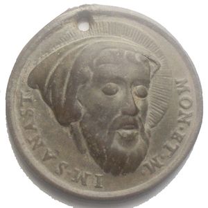 obverse: Medaglia devozionale di protezione contro il maligno e le ossessioni Ae XVIII sec.D/ il volto con aureola raggiata di S. Anastasio Magundat, monaco persiano del VII sec.,scritta: IM.S.ANAST.  MON.ET.M.= Immagine Sant Anastasio - monaco e martire(fu decapitato),si dice che la sua immagine faceva fuggire il demonio è proteggeva dai malefici.- R/ Scritta in otto righe,dentro cartella ornata,il significato dovrebbe far riferimento alla protezione del santo,circa l attribuzione all Abbazia delle tre Fontane di Roma è possibile,inquanto ci sono le reliquie del santo assieme a quelle di S. Vincenzo di Saragozza.  La medaglia originariamente era dotata di appiccagnolo,il buco è stato fatto successivamente per poterla portare o appendere,la medaglia non comune.