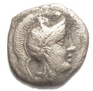 obverse: Tarentum. AR Diobol, 380-334 BC. Obv. Head of Athena right, wearing Attic helmet surmounted by Triton. Rev. Herakles fighting Nemean lion; to left, club; between Herakles legs, Δ. AR. g. 0.84 mm 11.3 x 11.57 