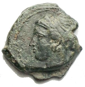 obverse: Sicily, Syracuse. AE Hemilitron (17.3 mm, 3.43 g), c. 400 BC. Obv. Head of Arethusa left, wearing single-pendant earring and necklace, hair bound in ampyx and sphendone; laurel branch behind. Rev. ΣYPA, dolphin swimming right, cockle shell below. SNG ANS 415; SNG Cop. 697; Laffaille 215; Virzi 1466. Green patina.  Very fine.