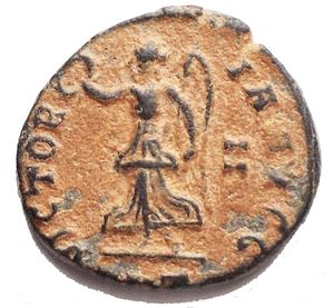 reverse: Time of Maximinus II Æ  Persecution Issue . Antioch, AD 310-313. IOVI CONSERVATORI, Jupiter seated left on throne, holding globe and sceptre / VICTORIA AVGG, Victory advancing left with wreath and palm, g 1,55. mm 14,5 x 13,5. Good Very Fine. Good Patina