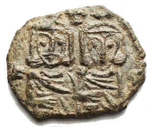 reverse: Byzantine Coinage - Constantine V Copronymus (741-775) - With Leo IV (741-775) - AE Follis (Syracuse 757-775, 3.16 g) - Busts of Constantinus V and leo IV facing / Bust of Leo III facing wearing chlamys and holding cross (S. 1569 / R. 1758) - VF+. Green patina
