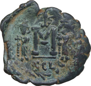 reverse: Constantine IV Pogonatus, with Heraclius and Tiberius (668-685).. AE Follis. Syracuse mint. Struck 669-672 AD