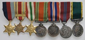 obverse: Regno Unito 1900-1943. Medagliere con 7 medaglie mignon.