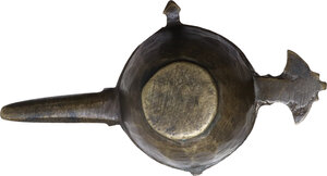 reverse: BRONZE ARAB-BYZANTINE ITEM Byzantine, c. 5th - 10th century AD. Arab-Byzantine oil lamp filler or cosmetic mortar with hemispherical body, deep rounded bowl with flat bottom, from which extends a long channelled spout, a flat decorated handle and smaller lateral lugs. Dimensions: 91 x 49.5 mm