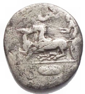 reverse: Sicily, Syracuse, c. 466-405 BC. AR Hemidrachm (15.5mm, 1.94g). Charioteer driving fast quadriga l.; above, Nike flying r., crowning charioteer; oval shield in exergue. R/ Head of Arethousa l., wearing sphendone; two dolphins around. SNG Ashmolean 2013 var. (symbol on obv.); HGC 2, 1366 var. (same). Very Rare, Good Fine/a Very Fine