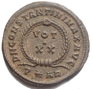 reverse: Constantine I. A.D. 307/10-337. Æ follis (19,48 mm. 3,28 g). Arelate, A.D. 322/3. CONSTAN-TINVS AVG, laureate head of Constantine I right / D N CONSTANTINI MAX AVG, VOT/XX in two lines within laurel wreath; P*AR. RIC 252. Brown patina. Good Extremely fine. 