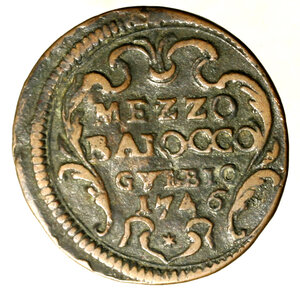 reverse: GUBBIO. Benedetto XIV (1740-1758) Mezzo baiocco 1746/ VII. Stemma R/ MEZZO/ BAIOCCO/ GVBBIO/ 1746/ stella in ghirlanda.    ( g. 5,63)    RARO    CU    SPL