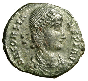 obverse: COSTANTE (337-350) Follis ridotto per Tessalonica (19 mm, g. 2,29) Busto diad. a ds. R/ Costante in abiti militari con globo sormontato da una fenice e con un labaro, su galea guidata da una vittoria alata. RIC 109   AE    raro    SPL