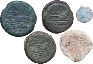 reverse: The Roman Republic. Lot of five (5) unclassified AE denominations, including a solid cast cockle shell aes formatum