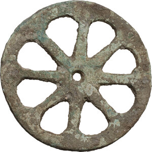 obverse: ANCIENT BRONZE WHEEL Greek world or Roman period, c. 1st millennium BC - 1st millennium AD. Medium-sized bronze wheel, composed of eight spokes, probably part of a toy. Diameter: 71 mm. Weight: 80 g