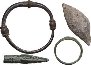 obverse: LOT OF FOUR ITEMS Celtic to Roman period, c. 3rd century BC - 4th century AD. Lot composed by a probably celtic silver premoney ring with knobs, a lead slingshot, a bronze arrowhead and a bronze ring