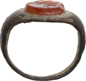 obverse: ROMAN RING WITH GEM Roman period, c. 1st - 4th century AD. Roman bronze ring with a carnelian gem depicting a stylized flower. Inner size: 16 mm