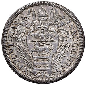 obverse: Roma - Innocenzo XI (1676-1689) Testone 1684 - D/ INNOCENTIVS - XI PONT MAX, stemma sormontato da chiavi decussate con cordone e tiara R/ MELIVS / EST DARE / QVAM / ACCIPERE / 1684, in cartella a targa destrorsa, con volute, fogliami e cordoni; in alto, un serafino - MIR 2035/11 Munt. 79 Ag 9,14 g R. SPL-FDC