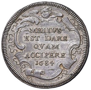 reverse: Roma - Innocenzo XI (1676-1689) Testone 1684 - D/ INNOCENTIVS - XI PONT MAX, stemma sormontato da chiavi decussate con cordone e tiara R/ MELIVS / EST DARE / QVAM / ACCIPERE / 1684, in cartella a targa destrorsa, con volute, fogliami e cordoni; in alto, un serafino - MIR 2035/11 Munt. 79 Ag 9,14 g R. SPL-FDC