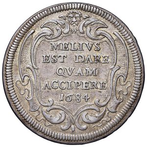 reverse: Roma - Innocenzo XI (1676-1689) Testone 1684 an. VIII - D/ INNOCEN XI - PONT M A VIII, stemma oblungo a punta con fogliame, sormontato da tiara e chiavi decussate seminascoste con cordone attorcigliato e fiocco R/ MELIVS / EST DARE / QVAM / ACCIPERE / 1684, in cartella a targa poligonale con fogliame chiusa in alto da testa leonina - MIR 2035/16 Munt. 70 Ag 8,99 g R. SPL/qSPL