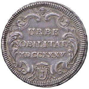 reverse: Roma - Clemente XII (1730-1740) Testone an. V - D/ CLEMENS XII - PONT M AN V, stemma sormontato da chiavi decussate con cordone e fiocco e da tiara R/ URBE / NOBILITATA / MDCCXXXV, in cartella con larga cimasa chiusa in alto da cherubino e in basso dall armetta di Mons. Casoni - MIR 2499/3 Munt. 53 Ag 8,21 g R. qSPL