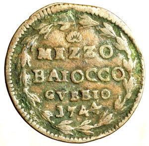 reverse: GUBBIO. Benedetto XIV (1740-1758) Mezzo baiocco 1744/ IV (g. 3,85) Stemma R/ conchiglia / MEZZO / BAIOCCO/ GVBBIO / 1744 in ghirlanda.   CU    RARO    +BB