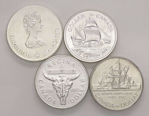 obverse: ESTERE - CANADA - Elisabetta II (1952-2022) - Dollaro 1979-1982-1987, 5 dollari 1973   AG  Lotto di 4 monete. SPL÷qFDC