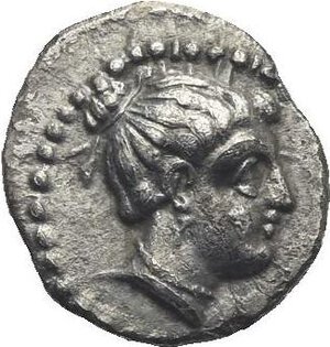 obverse: Cilicia. Nagidos. Circa 400-380 BC. Obol (Silver, 10.32 mm, 0.71 g). Head of Aphrodite to right, her hair bound up in a bun at the top of her head, wearing a drop earring and a pearl necklace. Rev. ΝΑΓΙ Bare head of bearded Dionysos to right; border of dots. SNG Levante 3. Toned. Extremely Fine.