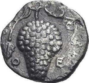 reverse: Cilicia. Soloi. Circa 410-375 BC. Obol (Silver 9.64 mm, 0.62 g). Helmeted head of Athena right. Rev. Θ - Ε, bunch of grape. SNG von Aulock 5872. Deeply toned. About Extremely Fine.