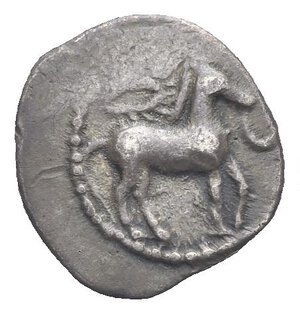 obverse: Sicily. Gela. Circa 465-450 BC. Obol (Silver, 11.61 mm, 0.76 g) Horse walking right, reins hanging down from his mouth; above, wreath. Rev. CEΛΑ, forepart of the river-god Gelas right, in the form of a man-headed bull. . Jenkins 259-290. HGC 2, 373. Nicely Toned. About Very Fine. 

