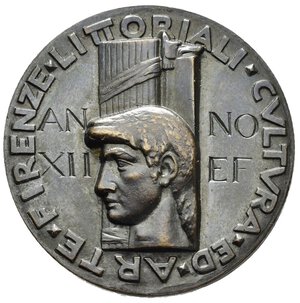 reverse: Medaglie Italiane – Regno d’Italia - Vittorio Emanuele III (1900-1945) - Ventennio Fascista – GUF - Firenze.  Medaglia statica emessa per i Littoriali del 1934 svolti a Firenze. Al dritto testa di uomo volta a s. su fascio littorio verticale intorno legenda LITTORIAALI CVLTVRA ED ARTE FIRENZE nel campo legenda incisa ANNO XII E F. Al rovescio legenda FASCISTI VNIVERSITARI, la figura della Vittoria ad ali spiegate di fronte regge fascio e serto di alloro in basso a s. G MANNVCCI. Opus Giannetto Mannucci. Realizzata in bronzo (AE) (Ø 34.1mm, 25.1g.). Riferimenti Casolari XII-61. Conservazione SPL/FDC.  