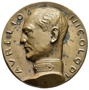 obverse: Medaglie Italiane – Regno d’Italia - Vittorio Emanuele III (1900-1945) - Ventennio Fascista – Nicolodi Aurelio - Unione Italiana Ciechi. Medaglia statica emessa nel 1931. Al dritto AVRELIO _ NICOLODI busto a sx in uniforme sul taglio spalla: A.G. SANTAGATA. Al rovescio L UNIONE • ITALIANA • DEI • CIECHI • AL • SUO • FONDATORE militare in piedi di spalle con torcia guida, verso dx, figura di cieco con bastone in esergo: MCMXXI - MCMXXXI = tre fasci. Opus Antonio Giuseppe Santagata Egidio Boninsegna. Realizzata in bronzo (AE) (Ø 38.7mm, 40.8g). Riferimenti Casolari IX-109. Conservazione SPL (tracce di ossidazione). Medaglia con alti rilievi.       