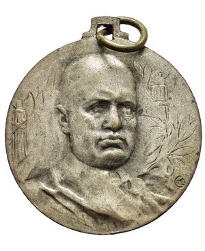 obverse: Medaglie Italiane – Regno d’Italia - Vittorio Emanuele III (1900-1945) - Ventennio Fascista – X Rivoluzione Fascista - Meccanica Agraria.  Medaglia portativa con piccola cambretta ed anello emessa nel 1932. Al dritto busto di Mussolini a dx con sciarpa tra due fasci repubblicani e rami d alloro a dx: CLM. Al rovescio grande X° ANNUALE con aratro sul campo, diagonalmente: DELLA = MARCIA = SU ROMA in basso: SETTIMANA DELLA MECCANICA = AGRARIA. Opus Egidio Boninsegna. Officina Lorioli & Castelli Milano. Realizzata in bronzo argentato (AE) (Ø 24.2mm, 7.1g). Riferimenti Casolari X-23. Conservazione BB.     