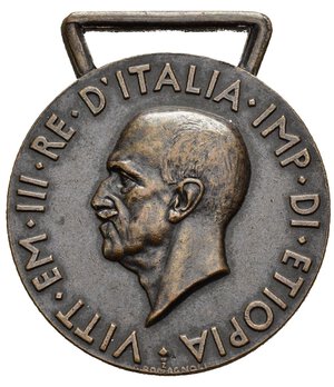 obverse: Medaglie Italiane – Regno D’Italia – Vittorio Emanuele III (1900-1945) –Ventennio Fascista – AOI– Conquista Etiopia - Regia Zecca Lettera A. Medaglia, con cambretta, commemorante le operazioni militari italiane svolte nel 1935-36 in Africa Orientale Italiana (AOI). Istituita con R.D. 27.4.1936 n. 1150, per i titoli acquisiti dal 3.10.1935 al 5.5.1936 (occupazione di Addis Abeba) nella campagna italo-etiopica. Al dritto il busto dell imperatore Vittorio Emanuele III volto a sinistra, intorno la scritta VITT EM III RE D ITALIA IMP DI ETIOPIA, in basso sotto al collo lettera 