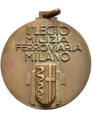 reverse: Medaglie Italiane – Regno d’Italia - Vittorio Emanuele III (1900-1945) - Ventennio Fascista – Milizia Ferroviaria – MVSN – Milano – Rara (R). Medaglia portativa con appiccagnolo ed anello dai forti rilievi. Al dritto _ • • • NVLLI _ SECVNDA busto di Miliziano a dx su ruota alata e fascio verticale con lama a dx sulla lama a dx: AFFER.  Al rovescio nel campo: II LEGIO = MILIZIA = FERROVIARIA = MILANO sotto: Stemma di Milano tra fasci verticali con lame divergenti. Manca nei riferimenti da noi consultati. Conservazione SPL (punti di ossidazione). Opus Costantino Affer. Realizzata in bronzo (AE) (Ø 32mm, 17.3g). 