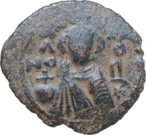 obverse: Arab-byzantine, Umayyad Caliphate. time of  Abd al-Malik ibn Marwan (AH 65-86 / AD 685-705). . AE Fals. Hims (Emesa) mint. Struck circa 685-690s