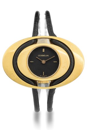 obverse: Gübelin Ellipse, anni 70 Cassa ellittica in oro 18k. Quadrante nero, indici applicati. Movimento a carica manuale. Cinturino in corda e fibbia Gübelin in oro. Dimensioni: 25 x 39 mm.Orologio non funzionante, revisione necessaria.